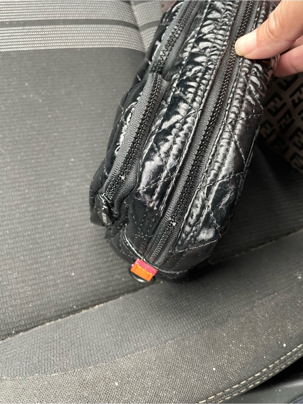 MZ Wallace Black Quilted Patent Wristlet with Orange Logo Patch